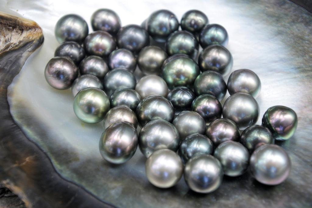 Close up detail of excellent round Tahitian Black Pearls.