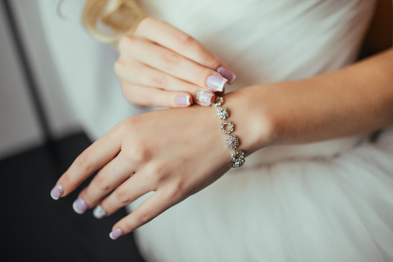 Wedding. Wedding day. Luxury bracelet on the bride's hand close-up Hands of the bride before wedding. Wedding accessories.