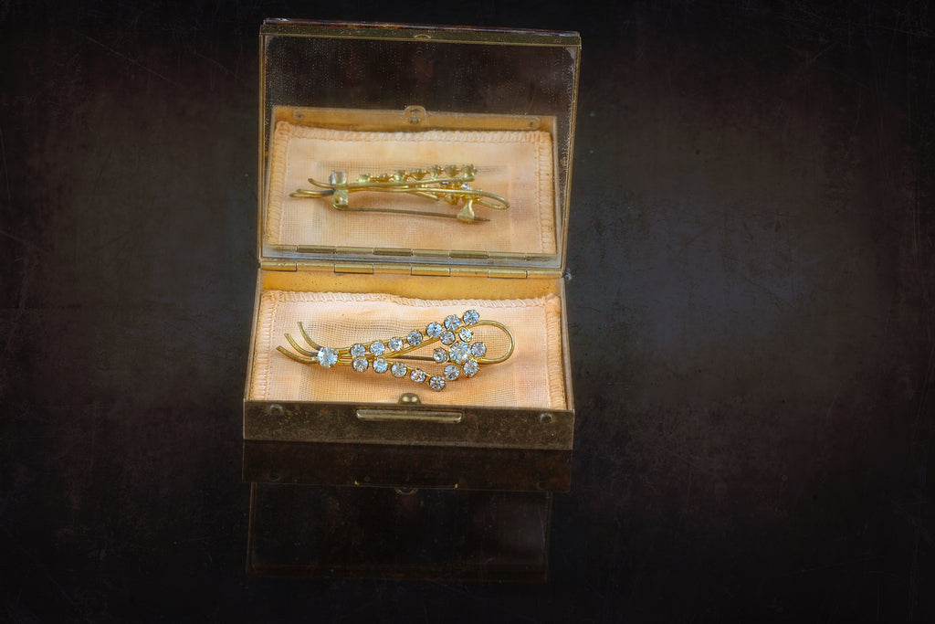 antique brooch in a box