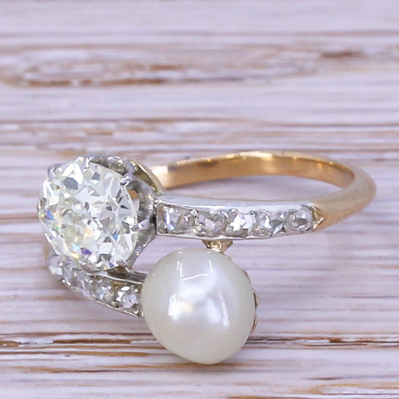 Edwardian 1.00 Carat Old Cut Diamond & Natural Pearl Crossover Ring, circa 1910