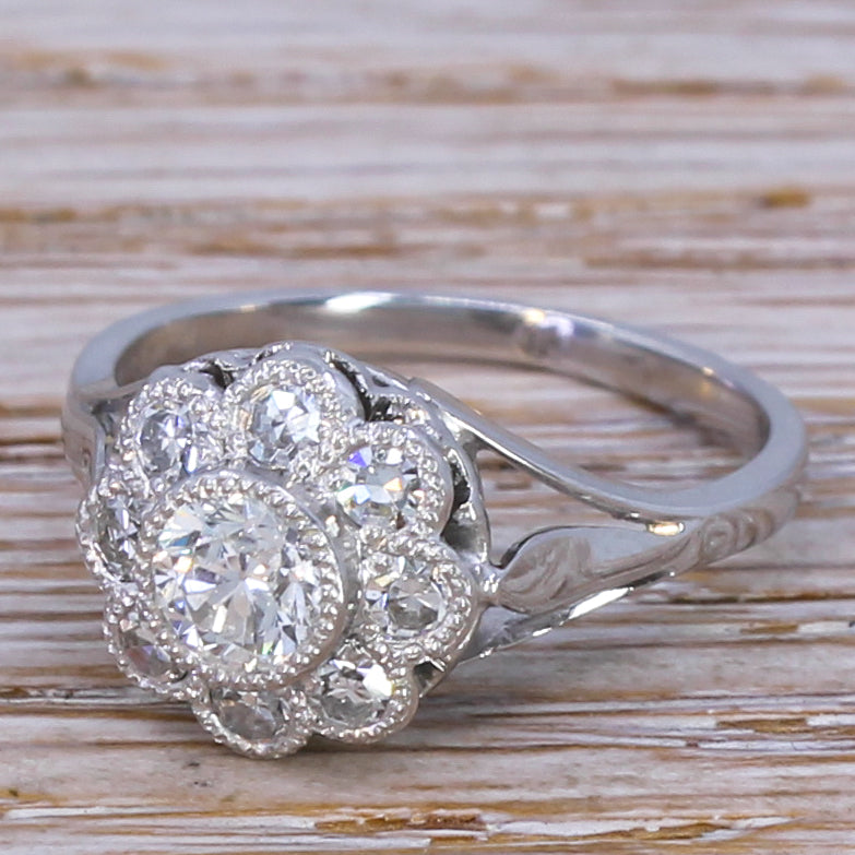 Retro 0.88 Carat Old Cut Diamond Daisy Cluster Ring, circa 1950